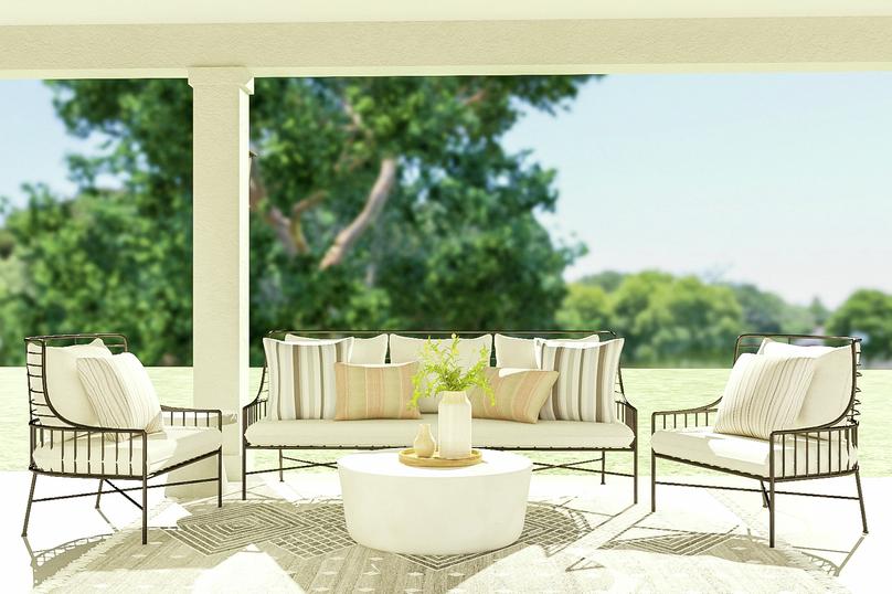 Rendering of the covered patio showcasing
  an outdoor sofa set, coffee table and rug in front of a stunning backyard
  view.