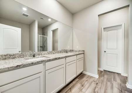 The master bath offers a stunning, dual-sink vanity.