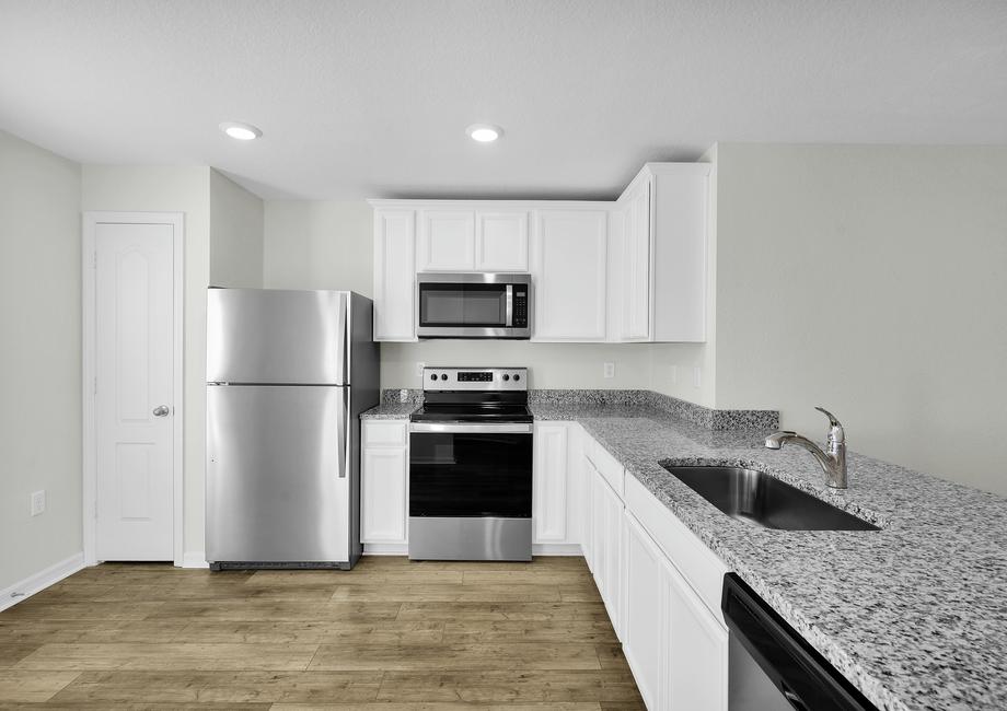 The kitchen comes chef ready with stainless steel appliances