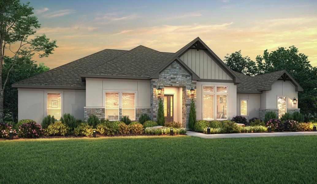 The Stratton plan dusk rendering with stucco and stone accents.