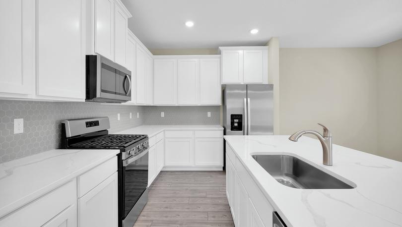 Chef-ready kitchen featuring recessed lighting, quartz countertops and all new stainless steel appliances.  