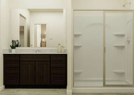 Rendering of the owner's bathroom dark
  wood vanity and glass walk-in shower.