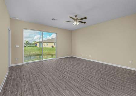 The family room is spacious with a sliding glass door that leads to the backyard