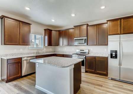 San Juan kitchen with stainless steel appliances, kitchen island, and granite counters