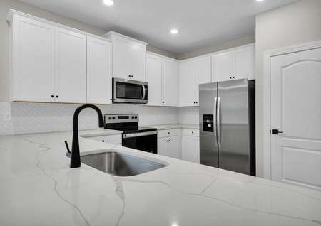 All new kitchen appliances, quartz countertops and recessed lighting come included in this floor plan.
