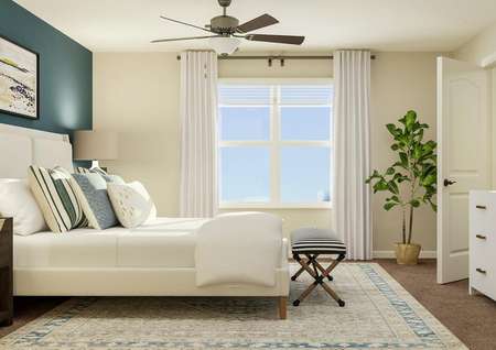 Rendering of spacious master bedroom with
  large white frame bed with blue accent wall on left, large window center,
  ceiling fan, and white dresser with décor on right.