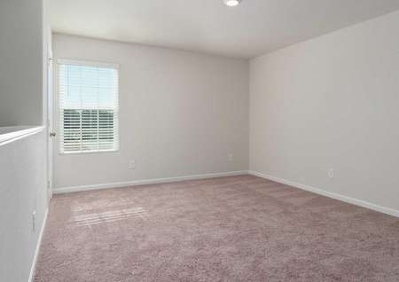 Avery floorplan room with tan carpeted floors, recessed lights, and white frame window