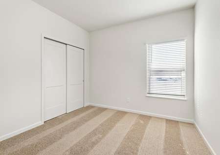 The guest bedroom is spacious and ready for your loved ones