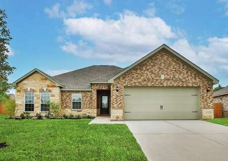 Brick and stone exterior with front yard landscaping