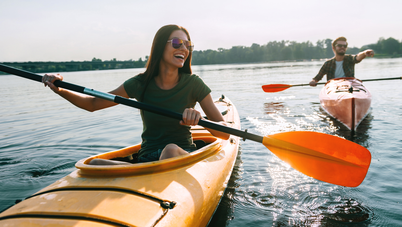 Young couple in a canoe on a beautiful lake.