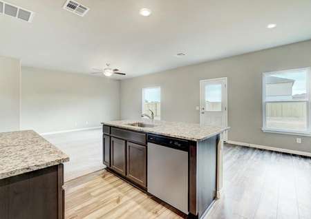 The chef-ready kitchen overlooks the dining and family room.