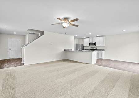Open floor plan with a large living room and a kitchen. 