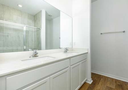 The spacious master bathroom featuring double sinks