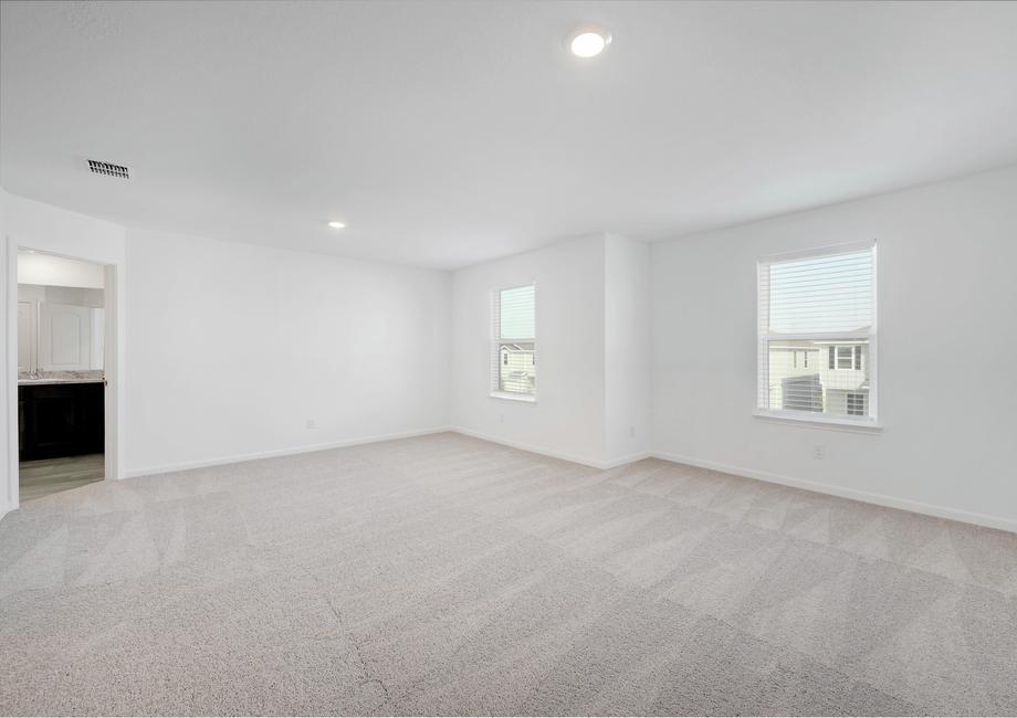 Spacious master bedroom with two windows to allow natural light in.