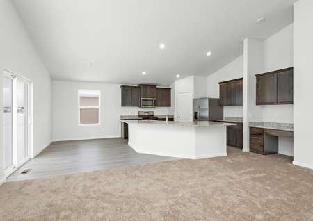 The entertainment space is open and including the dining room, kitchen, and family room