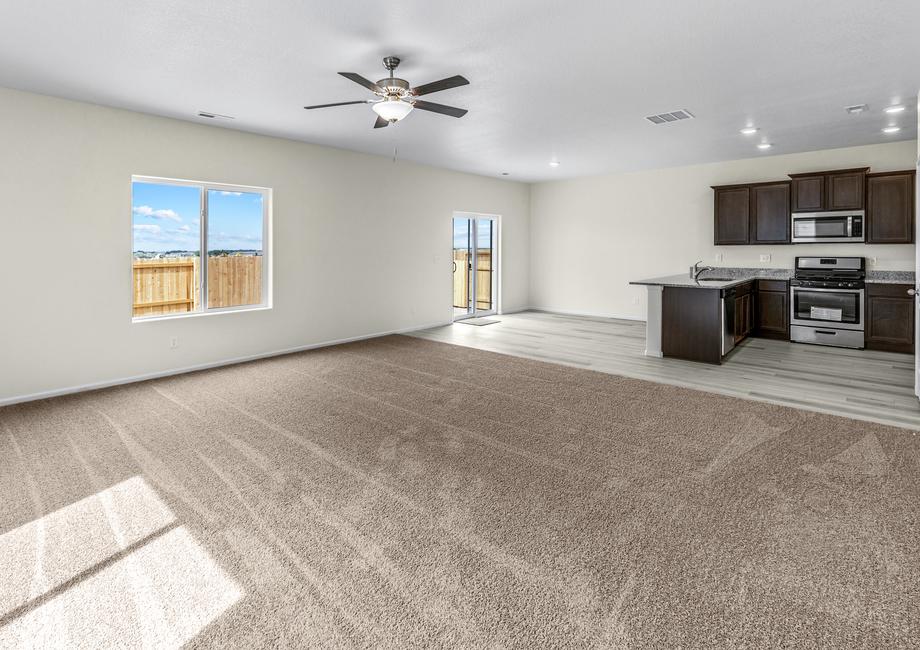 Open-concept layout with a spacious living room, breakfast area, and chef-ready kitchen.