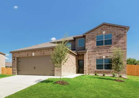 The Oakmont is brimming with curb appeal with a brick exterior and professional front yard landscaping.