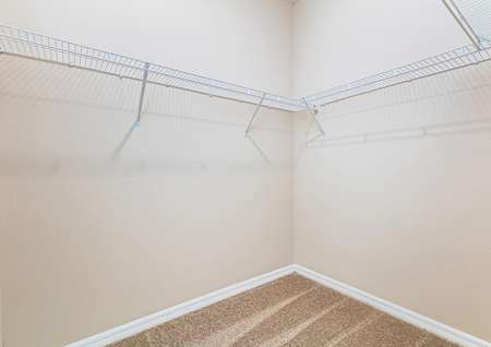 The secluded owner retreat hosts its own walk-in closet with plenty of storage space. 