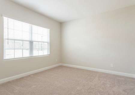 Allatoona bedroom with beige carpet, grey walls, and double window