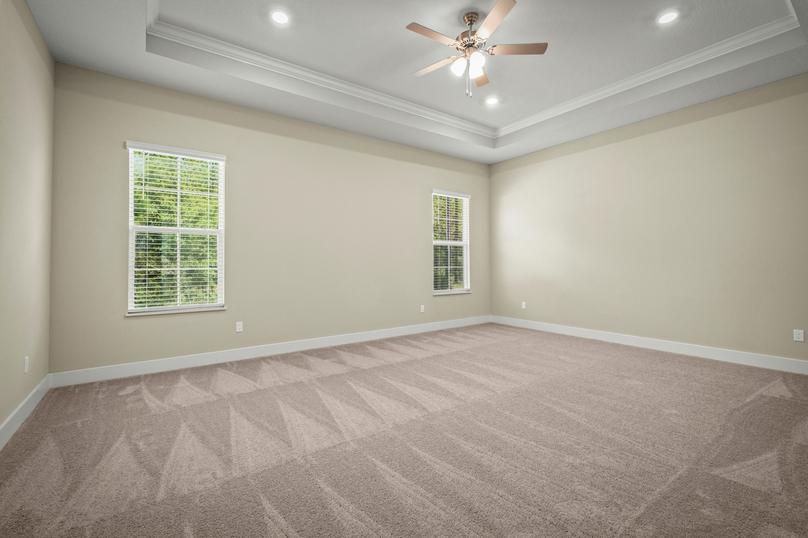 Master bedroom with carpet.