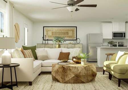 Rendering of living room with large
  couch, additional seating, round coffee table, and side table.