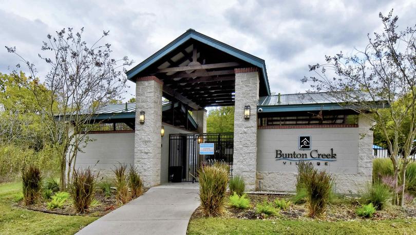 Bunton Creek new home community pool entrance with large welcoming sign