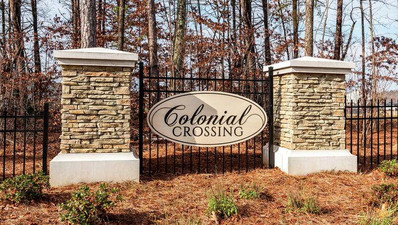 Colonial Crossing community monument with stone pillars.