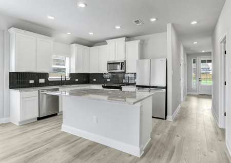 Gorgeous upgraded kitchen with granite countertops, stainless appliances, and wood-style flooring. 