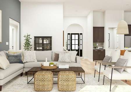 Rendering of the Mantle floor plan's
  living room with modern sectional softa and two armchairs surrounding a
  coffee table. The open floorplan extends into the kitchen and entryway, while
  a large painting hangs on the blue accent wall.