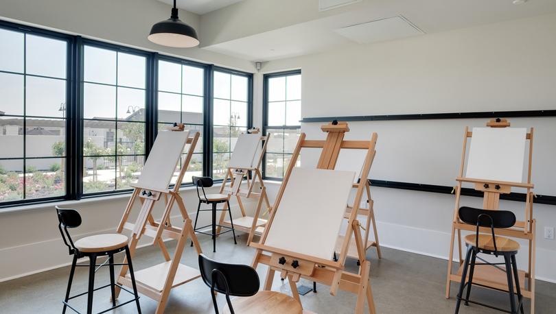 Art room at the Events Barn with easels and canvases.