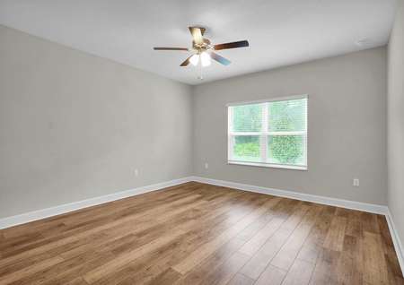The master bedroom is spacious and has plenty of natural light