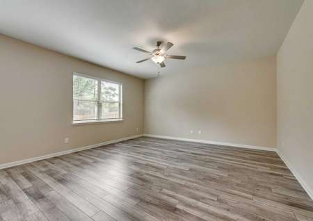 Saint Clair finished floor plan interior with wood style ceramic floors, white on brown colored walls, and overhead ceiling fan