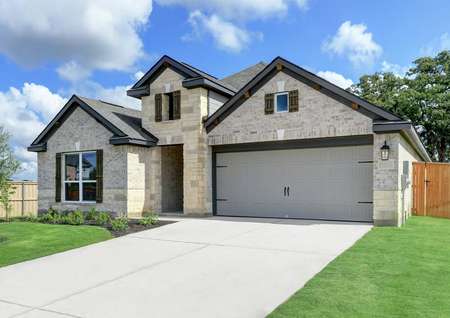 Angled exterior of the Caldwell plan, highlighting the two-car garage, attention-to-detail, and professional landscaping. 