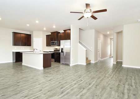 this open layout has the kitchen open to the family room and dining area