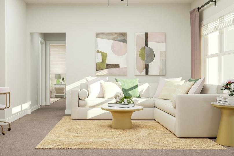 Rendering of the loft space featuring a
  large sectional and accent tables along a large window.