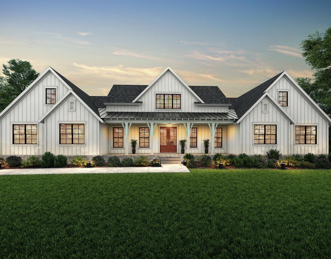 Dusk rendering of the two-story Talloulah with white siding, a large covered front porch and an attached sideload garage.