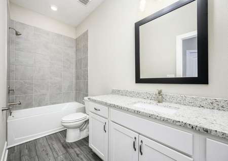 The spare bathroom is also spacious with a large vanity area