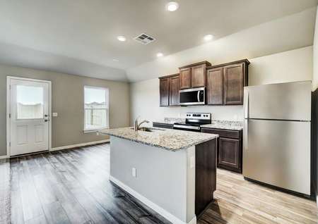 The heart of the home hosts a full suite of stainless steel appliances and plenty of cabinet space.