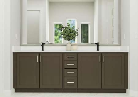 Rendering of the owner's bathroom
  showcasing a large double vanity with brown cabinetry and white
  countertops. 