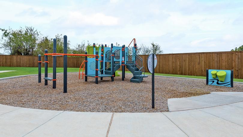The children's playground with a large playstrucure.