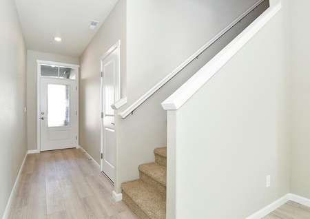 Photo of the foyer and stair entry to the Amethyst townhome by LGI Homes.