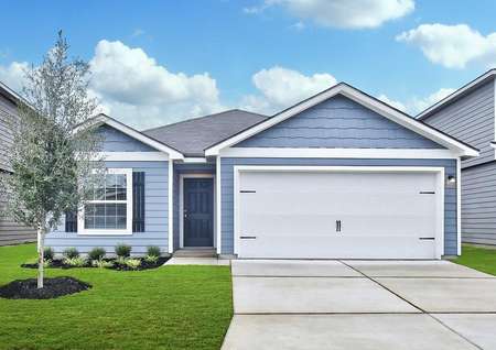 Frio single-floor house with light blue finish, white trim and garage, and green lawn