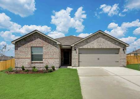 Sabine front exterior with single-story, brick finish, and lush green grass