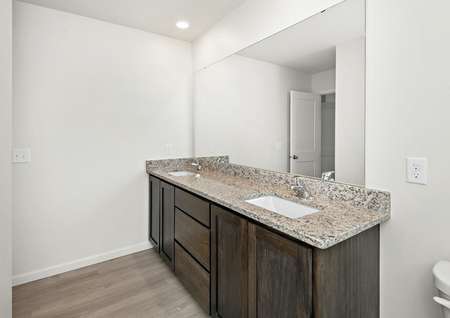 The master bathroom is spacious with a double sink vanity