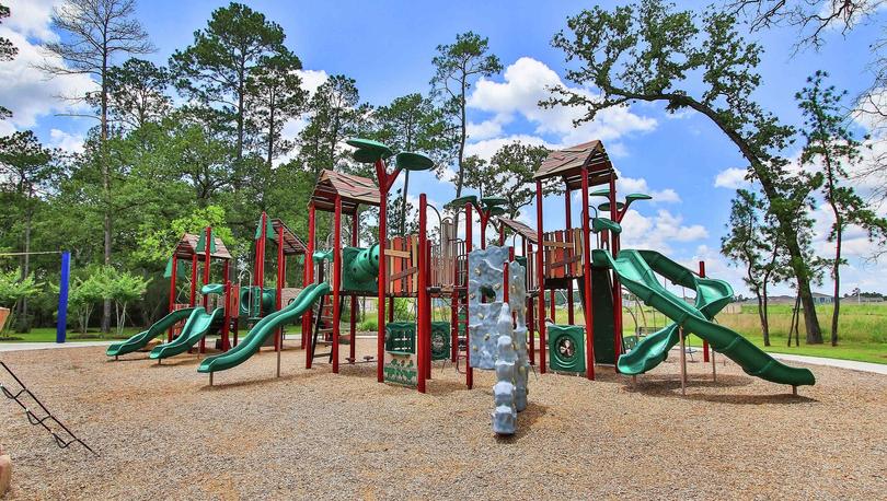 Williams Trace new home community playground with slides and climbing equipment