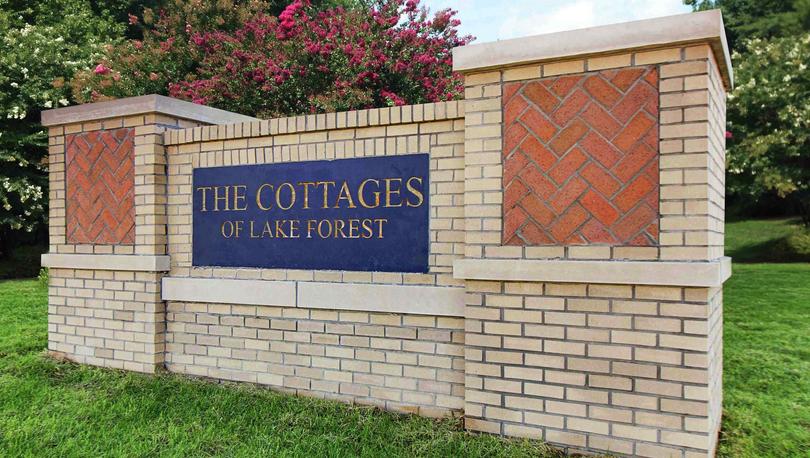 The Cottages of Lake Forest Monument with multicolored brick and professional landscaping