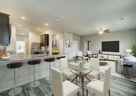 Staged home with a breakfast table and open family room.
