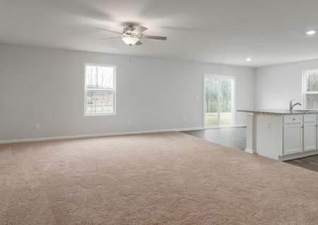 Avery great room with carpet flooring, recessed lighting, and ceiling fan