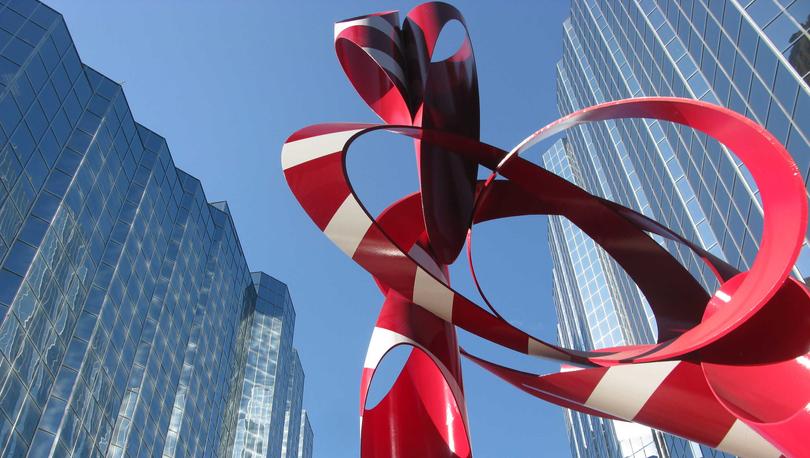 Sculpture in Oklahoma City, Oklahoma with glass skyscrapers behind it.