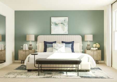 Rendering of the
  spacious master bedroom with large window and carpeted flooring. The space is
  decorated with a large cream-colored bed, two nightstands, a bench at the
  foot of the bed, blue-and-white rug, large mirror and blue-green accent wall.